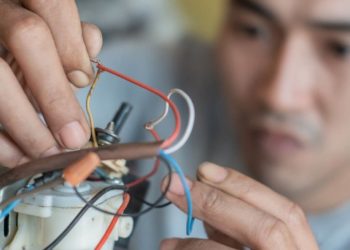 handyman restoring an appliace motor