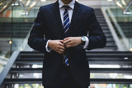 A smartly dressed man in a suit