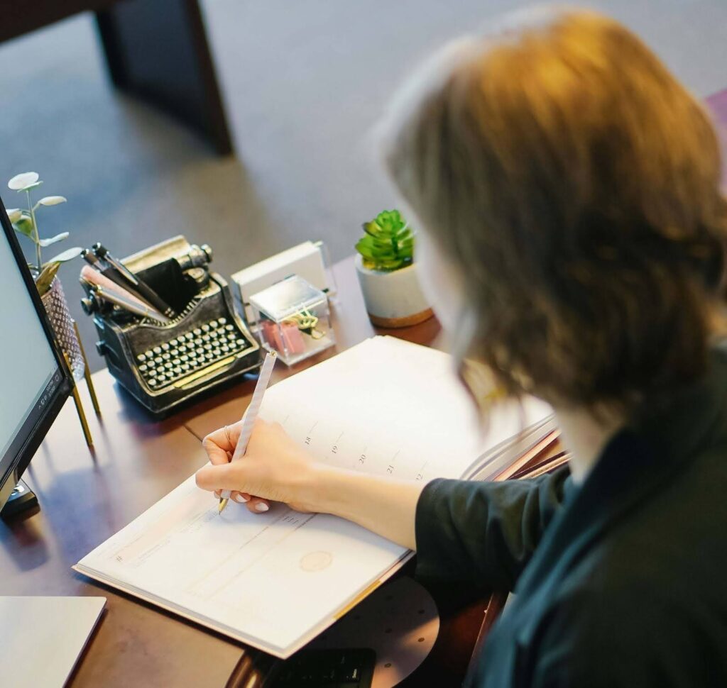 Lady writing in a book