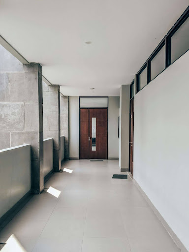 A clean, modern hallway in an unoccupied house, highlighting the potential need for special insurance coverage.