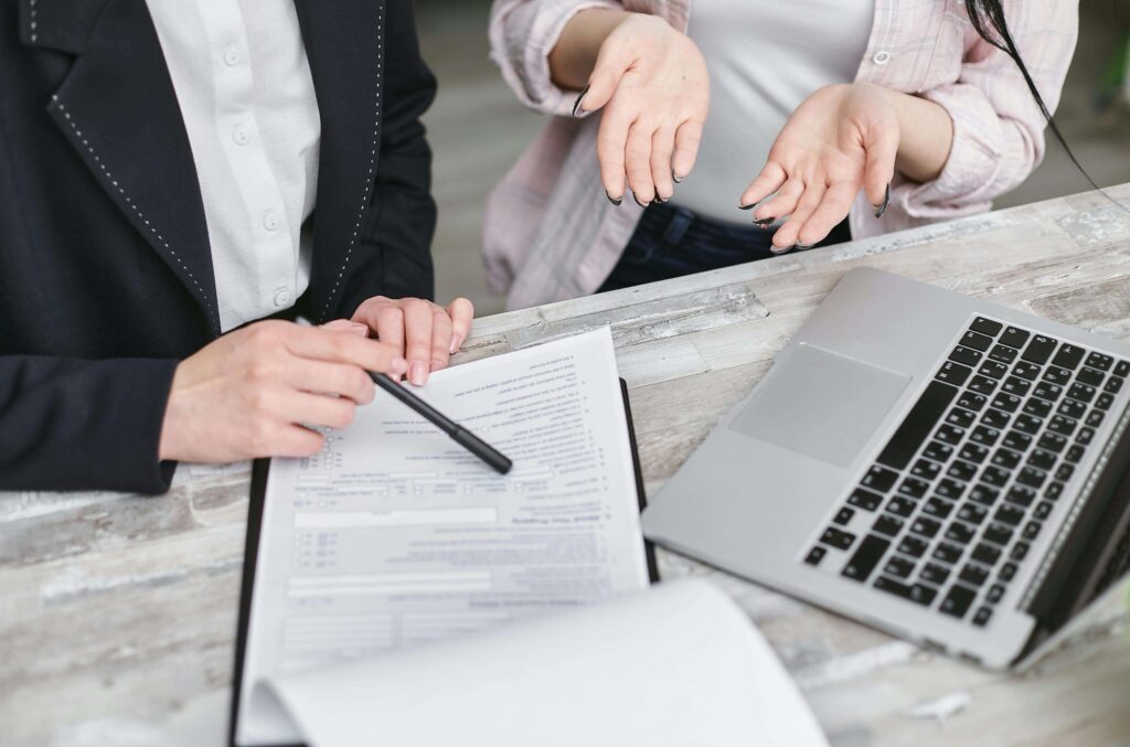 Two people discussing a claim