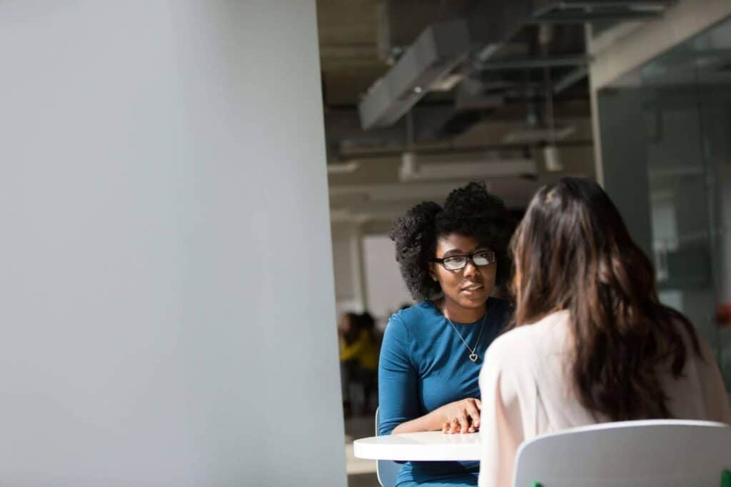 A business owner discussing insurance claim details during a meeting.