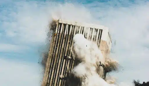 A building collapse caught in the moment of destruction.