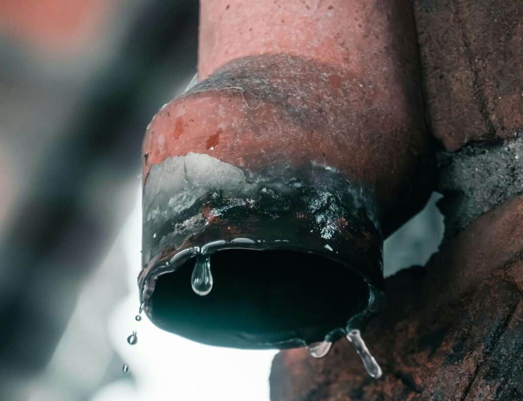 Water dripping from a frozen pipe.